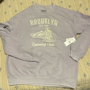 The color is a light purple/lavender. New with tags. Pacsun crewneck.